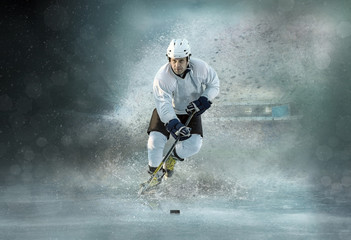 Naklejka premium Caucassian ice hockey Players in dynamic action in a professiona
