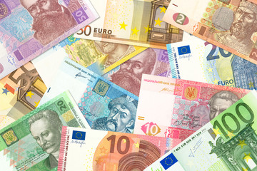 some ukrainian hryvnia banknotes and euro banknotes mixed indicating bilateral economic relations