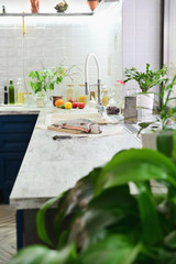 Raw fish for cooking with vegetables on the kitchen table.