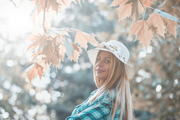 Young woman enjoying in autumn colored nature.