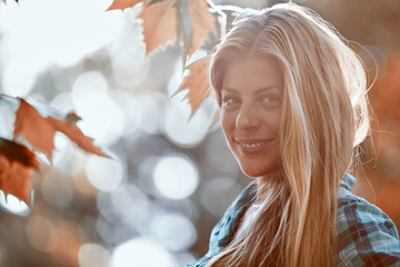Young woman enjoying in autumn colored nature.