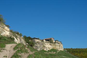 Fototapeta na wymiar View of the house of Firkovich. Bakhchisaray. Cave city of Chufut-Kale. Republic of Crimea.