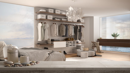 Wooden vintage table top or shelf with candles and pebbles, zen mood, over modern white and wooden bedroom with walk-in closet, parquet, window, white architecture interior design