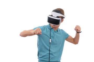 Caucasian young boy playing with virtual reality glasses dressed in a blue polo shirt isolated in white background