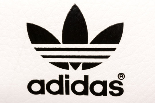 BUCHAREST, ROMANIA - JULY 23, 2014: Adidas Sign On Adidas Sport Shoes. Founded in 1924 is a German multinational corporation that designs and manufactures sports shoes, clothing and accessories.