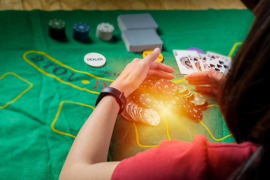 A man is gethering chips of card gambling with yellow light effect 