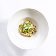 Risotto with boletus forest mushrooms top view