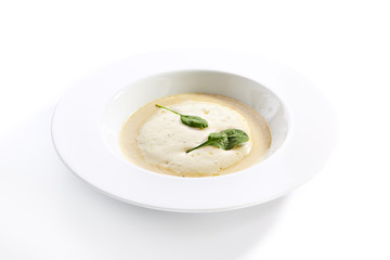 Cream soup with boletus forest mushrooms closeup