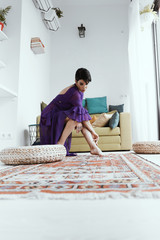 female with short haircut poses in Tbilisi loft