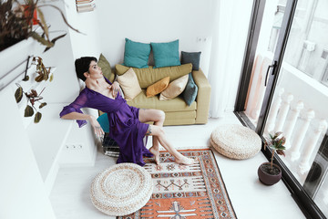 female with short haircut poses in Tbilisi loft