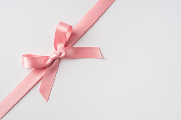 top view of pink bow isolated on white background