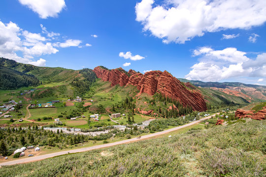 Top view of the ridge Seven Bulls, a village, river and road in the Jety Oguz gorge Kyrgyzstan