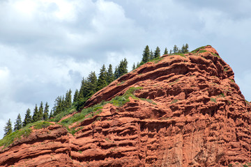 View of mountain ranges covered with coniferous forest in the Jety-Oguz gorge Kyrgyzstan