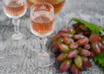 Traditional Italian grappa or liquor and grape.  Wine and grape.