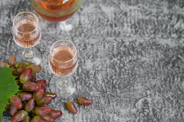 Traditional Italian grappa or liquor and pink grape.  Wine and grape. 
