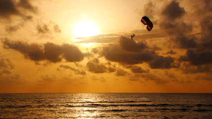 Parasailing in the sunset sky, Patong beach, Phuket, Thailand
