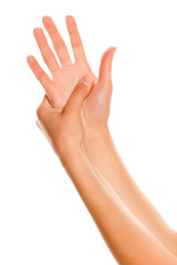 Young woman massaging her hand. Closeup on white background.