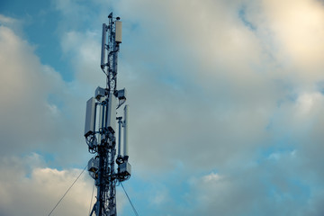 Cellular antenna. Mobile phone communication tower with blue sky