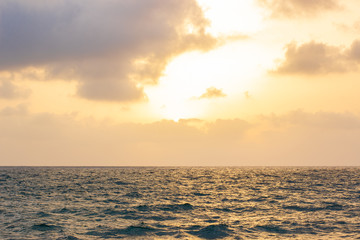 Fototapeta premium Atlantic ocean simple nature background landscape photography of wavy water surface foreground and horizon line with sunset cloudy sky 