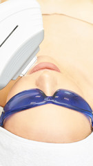 Laser facial hair removal. Cosmetology ipl device. Woman body in clinic. Medical beauty girl. Acne salon treatment tool
