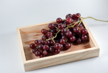 glass of pomegranate juice and cherries isolated on white background