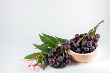 glass of pomegranate juice and cherries isolated on white background