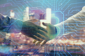 Double exposure of crypto economy theme drawing on cityscape background with handshake. Concept of partnership and blockchain