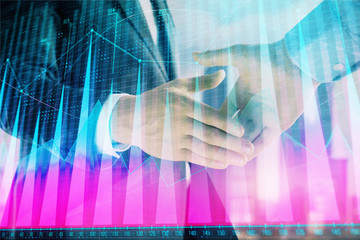 Double exposure of financial graph on cityscape background with two businessman handshake. Concept of stock market deal