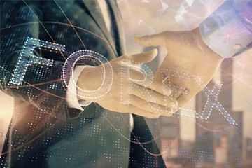 Double exposure of financial graph on cityscape background with two businessman handshake. Concept of stock market deal