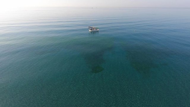 Aerial view of a Shrimp boat in the Mediterranean. Picking the typical "concha fina" Malaga&rsquo;s clam (Cytherea chione)