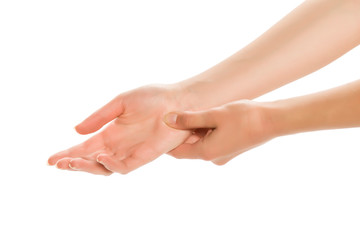 Hands of a young woman, massaging palm, isolated.