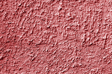 Grungy cement wall texture in red tone.