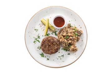 Meat patties with tomato sauce and cooked buckwheat with mushroom isolated on white background