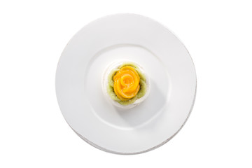 Mini Pavlova meringue nest with peach and kiwi on isolated on white background