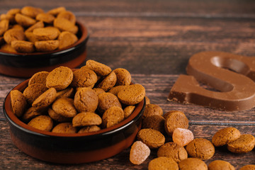 Dutch holiday Sinterklaas. Background with traditional food -  pepernoten, chocolate letter, sweets strooigoed and carrots for  horse. Concept for children party in Saint Nicolas day five december. 