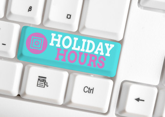 Writing note showing Holiday Hours. Business concept for Schedule 24 or7 Half Day Today Last Minute Late Closing White pc keyboard with note paper above the white background