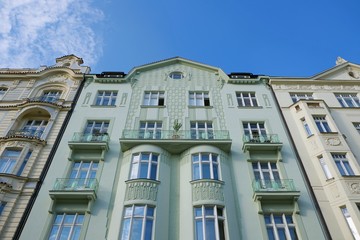 Fototapeta na wymiar Green tenement house in Prague