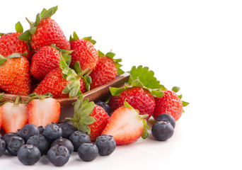 Fototapeta na wymiar A bowl set of beautiful and delicious strawberry and blueberry isolated on white background, close up, copy space, clipping path, cut out.