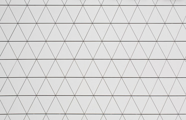 Fototapeta premium Silver geometric wall background with triangles.