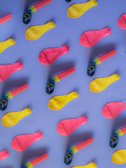 Obraz na płótnie Canvas Balloon and blower party pattern on purple background