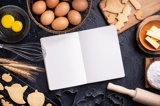 Making cookies cookbook recipe design concept, baking ingredients preparation layout with notebook, top view, flat lay, overhead, mockup copy space.