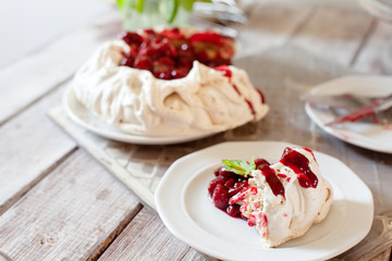 Delicious Pavlova cake with cherry