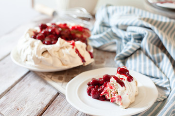 Delicious Pavlova cake with cherry