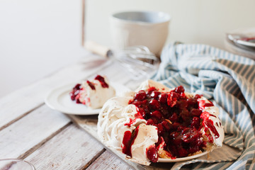 Delicious Pavlova cake with cherry