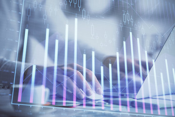 Double exposure of forex graph with man working on computer on background. Concept of market analysis.