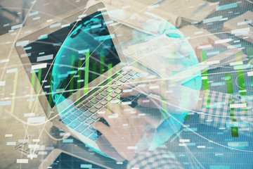 Multi exposure of businessman working on laptop on background. International business hologram in front. Concept of success.