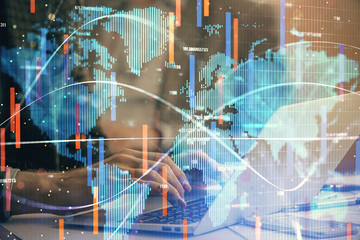 Multi exposure of businessman working on laptop on background. International business hologram in front. Concept of success.