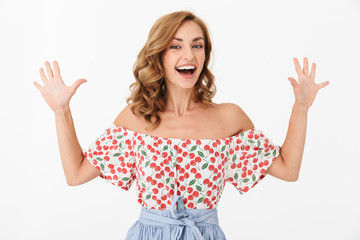 Surprised emotional happy young woman posing isolated over white wall background.