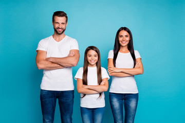 Portrait of smart people crossing their hands wearing white t-shirt denim jeans isolated over blue background