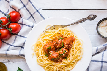 Delicious spaghetti with meatballs in tomato sauce on white background, italian cuisine